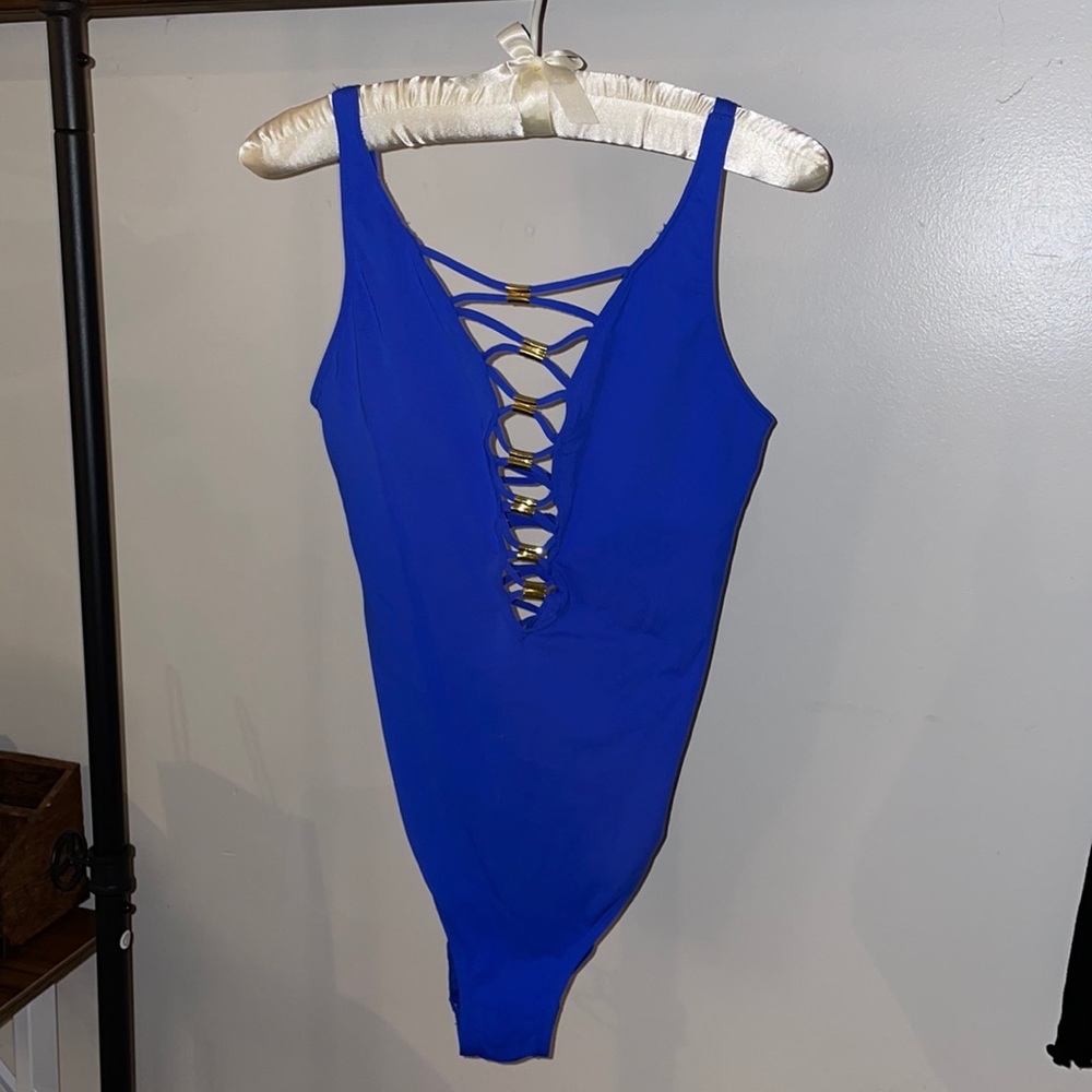 Blue one piece swimsuit with gold details